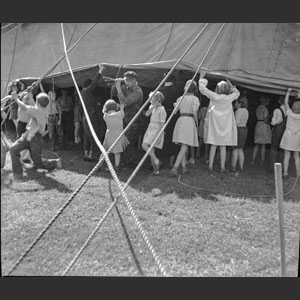 Kids at circus peeping under tent wall Ringling Bros