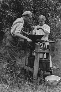Claudis N_ and Aunt Minnie making cider at Holts Corner at Haileys