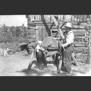Man Sharpening axe at Smothermans - Good