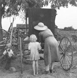 Aunt Minnie - Woman and little girl backs to camera unloading buggy - Betty Ruth