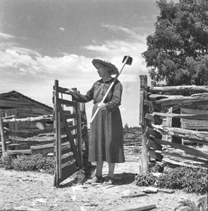 Country woman coming thru gate - Hoe on shoulder - Aunt Minnie