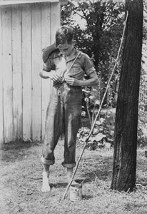 Wallace S_ Tying Up Pants with Rope